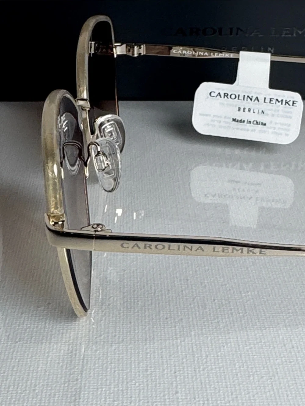Carolina Herrera Gold Frame Sunglasses with Brown Gradient Lenses